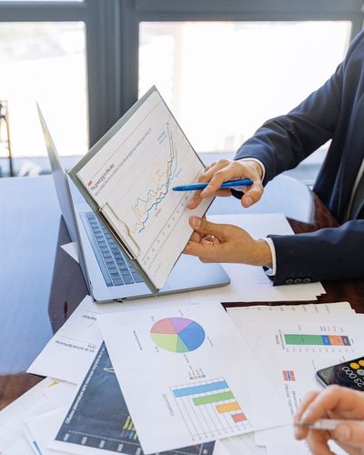 Corporate finance team discussing investment portfolio management